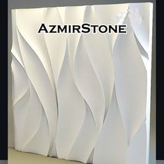 an artistic paper sculpture with the words azmrsttone on it's side