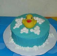 a cake with a rubber ducky in the bathtub on it's side