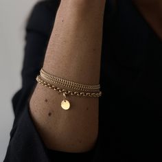 This classic and versatile bracelet is a statement piece in our opinion. The flexible and round design makes it comfortable to wear and allows you to easily add pendants if you would like to. Editorial Jewelry, Bracelet Photography, 2024 Street Style, Golden Bracelet, Double Bracelet, Bracelet Party, Jewelry Editorial, Friendship Bracelets Diy, Bee Necklace