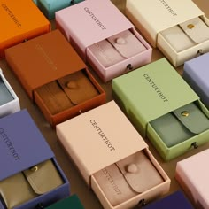 many different colored boxes with rings in them