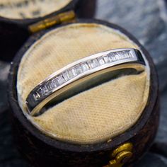 a close up of a wedding ring in a box