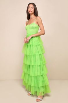 Treat any event like your own personal fashion show when you're wearing a show-stopping look like the Lulus Rule the Runway Lime Green Tulle Bustier Tiered Maxi Dress! This stunning dress is composed of sheer mesh tulle (atop a stretch knit lining) that shapes an alluring bustier-inspired bodice with seamed cups and supportive boning, a sweetheart neckline, and adjustable spaghetti straps. The high, fitted waist tops an A-line maxi skirt, adorned with fluffy tiers of tulle that are sure to make Green Fitted Corset Dress For Evening, Fitted Tulle Tiered Gown, Fitted Tiered Tulle Gown, Glamorous Overbust Dresses For Gala, Spring Cocktail Dress With Overbust Shape, Tiered Evening Dress With Fitted Bodice For Parties, Fitted Tiered Prom Dress, Evening Overbust Dress For Prom Season, Spring Party Gown With Spaghetti Straps