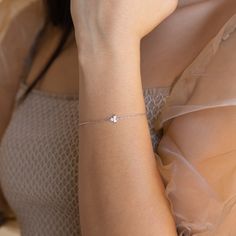 One, two, three, look at me! Take your evening attire to the next level with our Lily Triple Stone Bracelet, featuring a trio of glistening diamonds on a delicate chain. Material: High-Quality Solid 925 Sterling Silver Finish: Sterling Silver‚ 18K Gold‚ Rose Gold Featuring High Quality 2.5mm CZ Diamond, adjustable from 6 to 8 Inches SKU: RR-BR002 Single Line Diamond Bracelet, Minimalist Gold Plated Diamond Bracelet With Adjustable Chain, Hand-set Dainty Diamond Bracelet Gift, Luxury Dainty Diamond Bracelet, Tarnish Resistant, Minimalist 14k Gold Diamond Bracelet, Tarnish Resistant, One Two Three, Rose Gold Chain, Delicate Chain, Pretty Bracelets