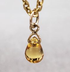 1. Citrine 14k Gold Pendant  2. Gemstone - Citrine  3. Jewelry Type - Pendant 4. Total Weight - 0.470 Gram Approx. 5. Citrine Weight - 1.50 Carats 6. Gold Weight - 0.170 Grams Approx. 7. Gold Purity - 14k 8. Pendant Bail Outer Size - 5 MM 9. Stone Shape - Teardrop  10. Ready to Dispatch in 1 - 2 days. 11. Handmade Items 12. AAA Quality Pendant 13. 1 Piece Available  14. Lovely Yellow Color 15. Citrine Size - 6x8 MM  Pictures are taken under natural and day light. Yellow Gold Teardrop Gemstones For Anniversary, Anniversary Yellow Gold Teardrop Gemstones, Gold Teardrop Gemstones For Formal Events, Yellow Gold Drop Birthstone Jewelry, Yellow Gold Drop Jewelry As Birthstones, Formal Gold Teardrop Gemstones, Gold Briolette Gemstones For Gift, Classic Teardrop Citrine Jewelry, Gold Drop Birthstone Necklace With Gemstone