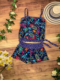 This tankini set includes the tankini top and shorts with graceful bohemian style print all over. Features a loose fit, adjustable spaghetti straps, contrast print trims and removable bust pads. Material: 82% Nylon, 18% Spandex. Lining: 100% Polyester.Care: hand wash in cold water, line dry. Beach Season Short Tankini For Pool, Short Tankini For Pool Beachwear, Beachwear Tankini For Pool, Short Tankini For The Pool, Sleeveless Lined Tankini For Summer, Summer Sleeveless Lined Tankini, Sleeveless Lined Summer Tankini, Summer Lined Tankini For Beach Season, Short Tankini For Beach Vacation