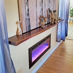 an electric fireplace in the middle of a living room