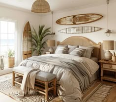 a bedroom with two surfboards hanging above the bed and an area rug on the floor