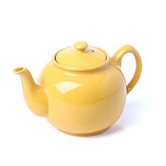 a yellow teapot with a handle on it's side and a white background