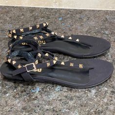 Brand New Bibi Lou Black Leather Thong Sandals. Gold Studded Detailing With Gold Adjustable Strap Buckle Closure. Never Worn. Gtd/Ik Spring Night Out T-strap Sandals, Trendy Black T-strap Sandals, Tie Up Sandals, White Leather Sandals, Strappy Flats, Braided Sandals, Sandals Gold, Anthropologie Shoes, Tan Sandals