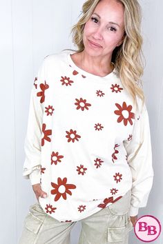 Introducing our Flower Power Mineral Washed Cotton Jersey Top, available in 3 colors. This lightweight pullover features a cute floral print, long sleeve, rounded neckline, and fun print. Layer it with a vest for a versatile look. With a pretty color combo and contrasting flowers, this top is both cute and stylish. With a variety of color options, our Flower Power Mineral Washed Cotton Jersey Top is a versatile addition to your wardrobe. Its floral print and contrasting colors make it cute and stylish, while its long sleeve and rounded neckline make it perfect for layering. Trendy Spring Long Sleeve Crew Neck Top, Spring Casual Long Sleeve Loungewear Top, Casual Long Sleeve Top For Spring Loungewear, Casual Long Sleeve Loungewear Top For Spring, White Long Sleeve Sweatshirt For Spring, Casual Long Sleeve Printed Sweater, Floral Print Crew Neck Top For Loungewear, Red Sweater For Spring Loungewear, Spring Graphic Print Long Sleeve Crew Neck Top