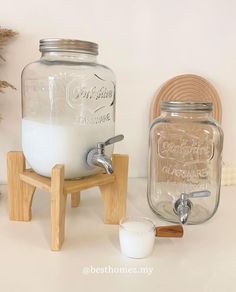 a glass jar sitting on top of a wooden stand