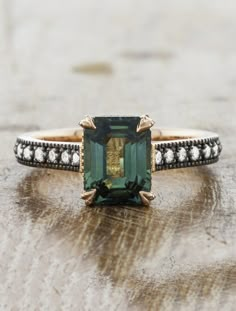 Emerald Black Diamond Ring, Emerald Unique Rings, Emerald Gem Stone Ring, Emerald Cut Antique Ring, Saphire Cocktail Ring, Vintage Color Engagement Rings, Emerald And Gold Jewelry, Moody Engagement Ring, Cushion Cut Emerald Ring