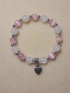 "Hand-made pink and white bracelet. Pink and white 8mm glass beads separated by silver spacers.  \"Made with Love\" charm added. Charm can be customized." 8mm Beads Bracelets, Cute Cheap Bracelets, 8mm Bead Bracelet, Cute Beads Ideas, Beaded Bracelets 8mm, Glass Beaded Bracelets Aesthetic, Bracelets Of Beads, Pink And White Beaded Bracelets, Braslets Designs Beads