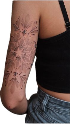 a woman with a flower tattoo on her arm