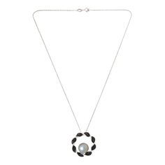 Kwan Collections Tahitian Pearl and Black Spinel Pendant with Chain  A shimmering black Tahitian pearl paired with the diamond-like sparkle of black spinel and fashioned into a beautiful, modern ring pendant design, makes an elegant addition to any accessories collection. Rope chain necklace included.       Pendant approx. 1"L x 1"W     Chain approx. 18"L x 1/16"W      Stamped .925; rhodium plating     Sterling silver, open circle pendant has twisted ribbon design embellished with pave-set, round, black spinel     Pendant has 11-12mm black pearl at center base     Rope chain necklace; spring ring clasp   Stone Information       All sizes and weights approximate     Cultured Tahitian Black Pearl - Off-round (11-12mm)     Black Spinel - Round (1.5mm); 1.82ctw Luxury Black Pearl Chain Necklace, Elegant White Gold Jewelry With Black Spinel, Luxury Black Tahitian Pearl Necklaces, Elegant Black Pearl Necklace With Charm, Elegant Black Pearl Drop Necklace, Black Pearl Chain Jewelry For Formal Occasions, Formal Black Jewelry With Pearl Chain, Elegant Black Pearl Necklace For Evening, Formal Black Pearl Chain Jewelry