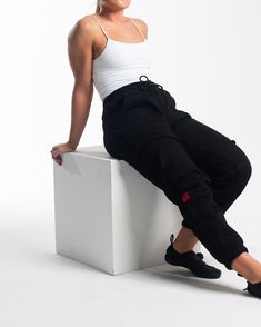 The Script collection was designed for daily comfort wear in and out the gym. Script Black Oversized Joggers - Stealth features: New cotton/ spandex supersoft fleece fabric Large front pockets Ankle cuffs Oversized fit Adjustable drawstrings Embroidered logos Woven hem tag on the right sleeve Athleisure Gym Pants With Drawstring, Athleisure Drawstring Pants For Gym, Sportswear Sweatpants With Drawstring For Gym, Sporty Sweats For Streetwear With Elastic Waistband, Urban Sweats With Pockets For Sports, Sportswear Cargo Pants With Elastic Waistband For Gym, Sporty Streetwear Sweats With Elastic Waistband, Sporty Cargo Pants With Side Pockets For Gym, Sporty Gym Pants With Drawstring