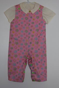 Girls floral print romper with snap crotch for easy changing. Comes with plain light yellow short sleeved shirt. This is a unique item and although I may use the same pattern, no two items are exactly the same. Playful Short Sleeve Onesie For Spring, Playful Short Sleeve Bubble Romper For Spring, Cute Short Sleeve Bubble Romper For Spring, Spring Cute Short Sleeve Bubble Romper, Summer Cotton Onesie With Floral Print, Spring Short Sleeve Bodysuit For Playtime, Fitted Short Sleeve Onesie For Playwear, Spring Bubble Romper With Short Sleeves For Playwear, Playful Fitted Bubble Romper With Short Sleeves