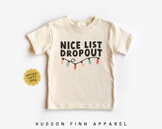 This 'Nice List Dropout' Toddler shirt is the perfect addition for your kids Christmas wardrobe. It comes in Baby, Toddler, and youth sizes so all your kids can match this holiday season!  Things to know: - Each item is made to order! - Please see our size chart below for specs. White bodysuits are Gerber Onesies® Brand. Natural bodysuits and toddler/youth shirt brands may vary depending on availability. - Machine wash cold, tumble dry low. To preserve the print for longer, wash inside out. - For personalized designs - enter customization in the "Add your personalization" field. - Orders ship next business day. - On a deadline? Upgrade to Priority Mail Express at checkout. ✿ BODYSUIT SIZE CHART ✿ 0-3 Months :: 21-24 in. / 8-12 Ibs. 3-6 Months :: 24-26 in. / 12-16 Ibs.  6-12 Months :: 28-30 Kids Christmas Shirts, Christmas Shirts Vinyl, Kids Christmas Shirt, Boys Christmas Shirt, Christmas Wardrobe, Christmas Toddler, Holiday Kids, Christmas Shirts For Kids, Toddler Size Chart