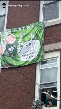 a banner hanging from the side of a building that reads, whatsapp? i will die for my rights