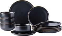 black and gold dinnerware set on white background