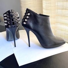 Guiseppe Zanotti Black Leather Ankle Boots. Size 36.5-6. 9.5" Long Inside Shoes Following Slope. 4.5" Heel Height. Edgy Studded Party Boots, Edgy Silver-studded Heels For Party, Leather Party Boots With Spikes, Chic High Heel Boots With Silver Studs, Edgy Ankle Heeled Boots For Night Out, Ankle-high Boots With Silver Studs For Evening, Edgy Studded High Heel Boots, Punk Heeled Boots With Metal Feet For Parties, Punk Style Heeled Boots With Metal Feet For Parties