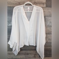 New Without Tags Elevated Basic And Classic Closet Staple Top. Sheer, Lightweight White Chiffon Blouse With Hidden Button-Up Front. Pullover Style With Button Cuff Sleeves And Side-Slits. Flowy, Effortlessly Chic And Timeless. Bust: 84” Sweep: 76” Length: 24.5” Sleeve Length: 28” 100% Polyester White Flowy Clothes, Elegant Chiffon Tops For Layering, Chic Chiffon Blouse For Layering, Flowy Chiffon Blouse For Work, Sheer Chiffon Tops For Work, White Chiffon Top For Workwear, White Chiffon Top For Work, Sheer Flowy Chiffon Top, Spring Sheer Blouse For Layering