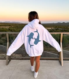 🌟 Thank you for stopping by GirlyThreadsCo! This coconut girl whale shark hoodie is made to order just for you! This is the perfect sweatshirt for coconut girls, friends or family who love the beach, or is great for everyday wear! 👕 PRODUCT & DESCRIPTION Our unisex hoodies are Gildan 18500 and are made of 50% cotton/50% polyester for that cozy feel and warmth you need in a hoodie. They have a classic fit along with the pouch pocket and the tear-away label. Because they are unisex, they may be a bit loose on some ladies, or more fitted for some men, depending on body type and preference of fit. Our tops do have a loose fit but overall true to size but please be sure to check the sizing chart to choose the right size for your preferred fit. 🚛 SHIPPING AND PRODUCTION TIME 2-7 days is neede Casual Long Sleeve Sweatshirt With Shark Design, Casual White Shark Design Tops, Casual White Tops With Shark Design, White Casual Tops With Shark Design, Whale Hoodie, Ocean Sweatshirt, Shark Clothes, Beach Hoodies, Outer Banks Shirt