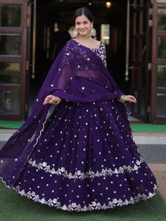 Introducing our fabulous violet embroidered georgette function wear lehenga choli, the perfect outfit for your special occasions. This stunning ensemble features a violet color georgette lehenga with heavy sequin and embroidered work, paired with a matching georgette choli adorned with heavy sequin work and multi-embroidered detailing. The look is completed with a georgette dupatta featuring sequin multi-embroidered arco cut work and designer lace work.
This outfit includes high-quality georgett Navratri Purple Sharara With Dabka Work, Purple Anarkali Set With Dabka Work For Reception, Navratri Purple Sharara With Resham Embroidery, Purple Semi-stitched Sharara With Dabka Work, Semi-stitched Purple Sharara With Dabka Work, Purple Bollywood Sharara With Dabka Work, Bollywood Style Purple Sharara With Dabka Work, Purple Sharara For Reception And Navratri, Purple Floor-length Saree With Dori Work