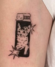 a cat in a cell phone tattoo on the arm