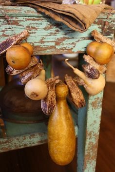 an assortment of fruits and vegetables hanging from a chair