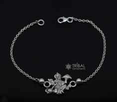 925 sterling silver handmade custom design  'Lord Hanuman' Bracelet Or Rakhi with solid  chain, this is a special design bracelet rakhi for Rakshabandhan Festival in India, best wishes gift for your brother and sister's,  Metal-925 sterling silver. Item type-Rakhi Bracelet. Length-6 to 8 inches.(length will be customized if buyer request) Weight-3.600 grams. Hanuman pendant size-2.1 cm diameter. Stamped-925. Make excellent gifting and collectible pieces(gift for birthday, wedding, anniversary, m Traditional Silver Chain Bracelets Gift, Traditional Sterling Silver Chain Bracelet Gift, Engraved Silver Spiritual Chain Bracelet, Spiritual Engraved Silver Chain Bracelet, Personalized Symbolic Silver Bracelets, Traditional Silver Bracelets Personalized, Traditional Silver Personalized Bracelets, Traditional Personalized Silver Bracelets, Silver Name Bracelet With Polished Finish As Gift