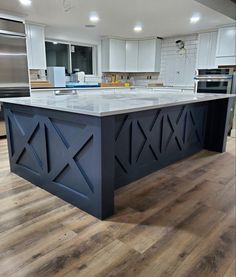 a large kitchen island in the middle of a room