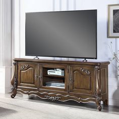 If your TV is your most prized possession, the Latisha TV stand is the perfect place to showcase it. Thanks to the natural beauty, strength, and quality. This design will be a sophisticated, sturdy addition to your living room. A timeless, versatile antique oak finish highlights the woods authentic characteristics and enriches the molding and panel details. Featuring open shelves, closed storage, and cord management to help keep a tidy living space. Tv On Table, Antique Tv Stand, Country Tv Stand, Tv Stand Antique, Antique Tv Stands, Tv Consoles, Black Room, Acme Furniture, Cord Management