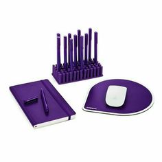 a purple mouse pad, keyboard and pen holder