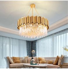 a living room filled with furniture and a large chandelier hanging from the ceiling