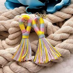 ✨️FREE SHIPPING (USPS First-Class Mail) and will ship out in ONE Business Day ✨️ "Vibrant Striped Tassel Earrings: A Spring/Summer Symphony of Color" Step into the bright side of fashion with our Vibrant Striped Tassel Earrings, tailored perfectly for the Spring and Summer seasons. Swirling in a harmonious yellow, blue, and pink blend, each tassel tells a story of vibrant sunsets, clear blue skies, and blooming flowers. Handcrafted with precision, these earrings exhibit the elegance of simplicit Multicolor Tassel Earrings For Beach In Spring, Multicolor Woven Earrings For Beach, Multicolor Woven Beach Earrings, Beach Multicolor Woven Earrings, Handmade Multicolor Earrings For Beach, Multicolor Beaded Tassel Earrings For Beach, Multicolor Tassel Earrings For Beach, Yellow Tassel Earrings For Summer Gift, Bohemian Multicolor Tassel Earrings For Beach