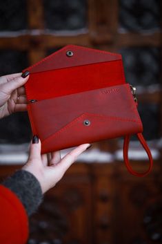 Model: ARNHEM Indulge in the perfect blend of style and functionality with our Crazy Horse Leather Wristlet Wallet Clutch. Meticulously handcrafted from genuine Crazy Horse leather, this compact accessory is designed to make a lasting impression. Roomy, voluminous wallet made of genuine cattle leather. For people who like to carry everything with them at once. In your wallet you can arrange bills, coins, credit cards, business cards, and a phone in a convenient order for you. * The wallet clutch Clutch Bags With Wrist Strap As Gifts, Classic Clutch Mobile Phone Bag As Gift, Classic Mobile Phone Bag Clutch As Gift, Classic Pouch Wallet With Wrist Strap, Classic Rectangular Wristlet For Gift, Classic Rectangular Wristlet Perfect As A Gift, Classic Rectangular Wristlet As Gift, Pouch Wallet With Wrist Strap As Gift, Handmade Red Clutch Wallet