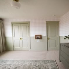 a bedroom with two doors and a basketball hoop on the wall