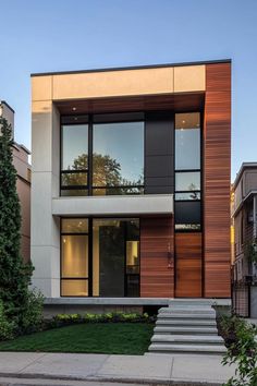 a modern house with stairs leading up to it