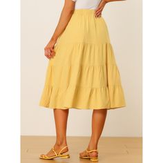 Slant pockets for effortless wear and an A-line tiered flare hem help to create an elegant and flowy look in spring or summer. In a midi length, this skirt with a fit-and-flare silhouette and an elastic waist exudes a carefree summer feel. This midi skirt features a ruffle hem and side pockets for a crisp finish to any look. Pair it with any sandals to create a variety of looks.