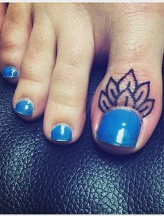 a woman's toe with a small tattoo on the top and bottom of her toes