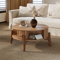 a living room with a white couch and coffee table