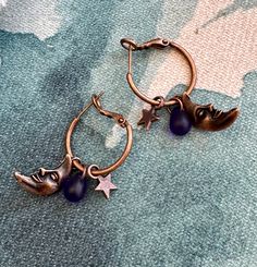 Fun copper half moon, copper star, and cobalt blue teardrop on Copper Lever Back Hoops.  The half moon is 19x9mm and dangle a little over an inch. The copper hoop is 20mm Very light weight and so pretty in the light.  Great for work or casual.  I love how this design came together. The half moon is so whimsical with a smile. The star and moon are double sided. The cobalt blue teardrop reminds me of the night sky.   UniquelybyRuth pays for your first class shipping when your order is $35 or more, so take a look around the shop and see if anything else calls to you! 🆓 Celestial Style Nickel-free Metal Hoop Earrings, Celestial Style Nickel Free Metal Hoop Earrings, Nickel Free Celestial Metal Hoop Earrings, Celestial Metal Hoop Earrings Nickel Free, Celestial Style Metal Hoop Earrings Nickel Free, Celestial Metal Hoop Earrings With Moon Charm, Adjustable Nickel-free Celestial Hoop Earrings, Star And Moon, Double Face