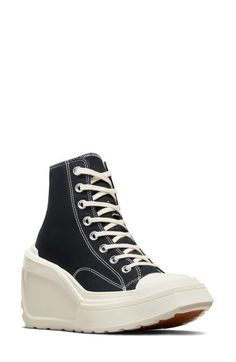 "Find CONVERSE Chuck 70 De Luxe High Top Wedge Sneaker on Editorialist. A lightweight wedge heel and platform boost this fierce rewrite of an iconic high-top sneaker outfitted with a canvas upper and lug sole for durability. 4 1/2\" heel; 2\" platform (size 8.5) 3 3/4\" shaft Lace-up style Textile upper and lining/rubber sole Imported" High Top Sneaker Outfit, High Top Wedge Sneakers, Black Wedge Sneakers, Converse Chuck 70, Chuck 70, Sneakers Outfit, Lug Sole, Wedge Sneaker, Converse Chuck