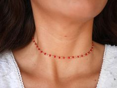 This modern stacking  chocker necklace is made with Gold Plated Rosary Chain adorned with Red Cristal Glass Beads. ➵ Perfect to wear as Chocker or Double turn Bracelet.➵ The necklace length is ajustable thanks to 5 cm extender chain.--*--*--*--*--*--*--*--*--*--*--*--*--*--*--*--*--*--*--∞ SIZE ∞- length: 32 cm (12,6 in) to 37 cm (14,6 in) with the little extender chain.Closing-system : Adjustable∞ MATERIAL ∞- Gold plated over brass- Cristal BeadsNickel free jewelry !∞ COLOR ∞- Gold- Red--*--*-- Gift Beaded Clavicle Chain Choker, Beaded Choker Necklace For Gift, Gift Beaded Choker Necklace, Red Beaded Chain Necklace Gift, Red Beaded Chain Necklace For Gift, Gift Red Beaded Chain Necklace, Red Clavicle Chain Choker, Gift Delicate Chain Choker With Round Beads, Red Choker With Adjustable Chain For Gifts