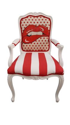 a red and white striped chair with lips on it