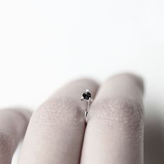 Handmade natural diamond sterling silver hug earrings. Each earring hugs the ear with a natural black diamond held with three prongs at the front. The diamond is set inverted. Diamond: 2.5mm, opaque Dimensions: 10x9mm Sold: Individually or as a pair Also available with white sapphires (last photo): https://www.etsy.com/listing/252736724/sapphire-thorn-white-sapphire-earring * Please note these earrings come with no backings as their shape secures them in place. Visit my shop: http://www.etsy.com Black Diamond Earrings Gift, Black Diamond Earrings As Gift, Everyday Sterling Silver Jewelry With Prong Setting, Sterling Silver Earrings With Black Diamonds For Anniversary, Minimalist Round Black Diamond Jewelry, Sterling Silver Jewelry With Black Diamonds Round Cut, Sterling Silver Jewelry With Black Diamonds In Round Cut, Sterling Silver Jewelry With Black Diamonds, Everyday Silver Jewelry With Prong Setting