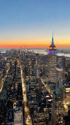 an aerial view of new york city at sunset