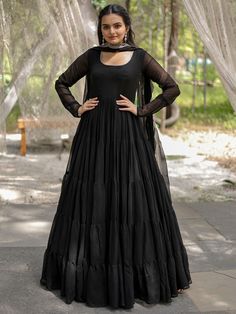 This enchanting black georgette reception wearing a plain gown with a dupatta is a stunning piece that will make you stand out at any event. Made from high-quality georgette material, this gown is designed to make you feel elegant and confident. The similar color georgette dupatta features rich sequins embroidered work and designer lace work, adding a touch of glamour to your overall look.
This gown includes a 5-layer frill design, fully stitched and available in XS to XXL sizes. With a 12-meter Black Georgette Party Dress, Floor-length Georgette Dupatta For Evening, Elegant Georgette Maxi Dress With Dupatta, Black Chiffon Dupatta For Wedding, Black Semi-stitched Wedding Gown, Wedding Maxi Dress With Sheer Dupatta In Georgette, Black Floor-length Maxi Dress For Wedding, Wedding Black Chiffon Dupatta, Black Semi-stitched Gown For Reception