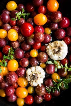 a pan filled with lots of different types of fruits and vegetables on top of each other